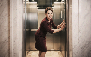 Staff member using an elevator
